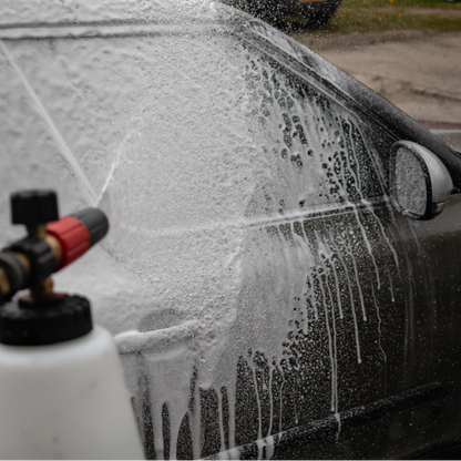 Applying Auto Glanz Cannon Coat via foam lance for instant ceramic protection.